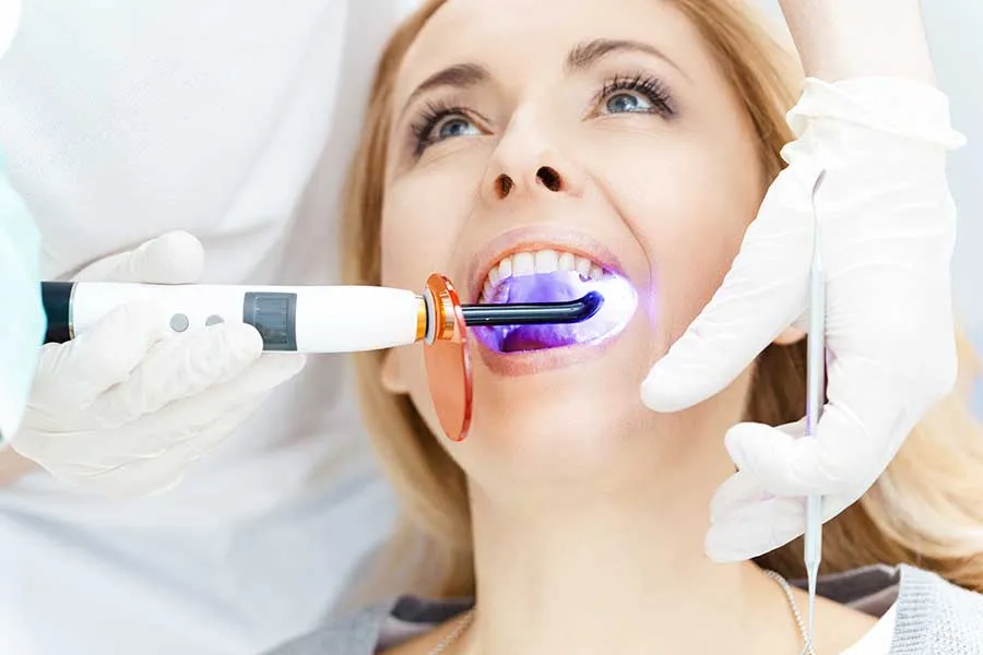 Young female patients receiving a teeth whitening treatment in Las Vegas. 